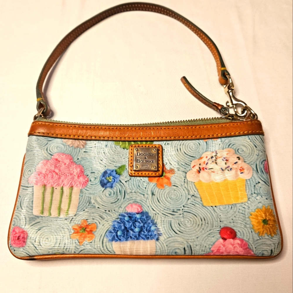 Dooney & Bourke Cupcake and Flowers Blue Mini Pouch With Leather Strap.